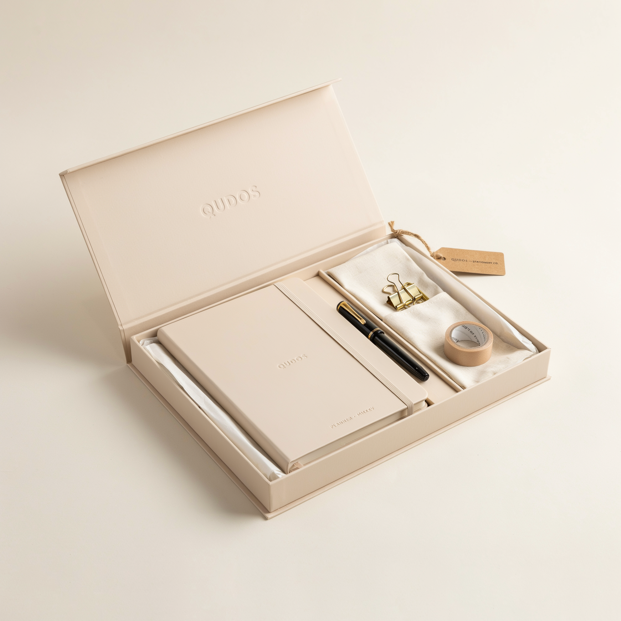 Qudos gift box with planner, pen, tape and gold clips
